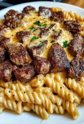 Cajun Steak Tips with Cheesy Parmesan Twisted Pasta